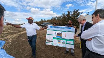 A research poster is being presented while in the field on a USDA NIFA visit.